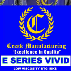 Creek Manufacturing ink bottles with logo and text on a blue background