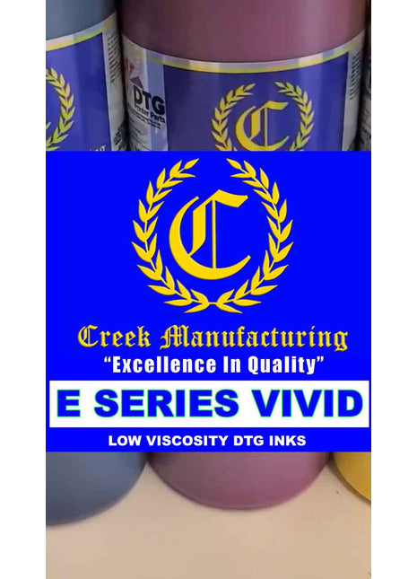Creek Manufacturing ink bottles with logo and text on a blue background