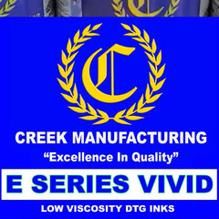 Creek Manufacturing ink bottles with logo and text on a blue background