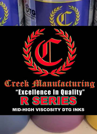 Creek Manufacturing ink bottles with logo and text on a black background