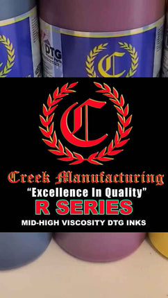 Creek Manufacturing ink bottles with logo and text on a black background