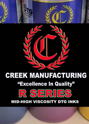 Creek Manufacturing ink bottles with logo and text on a black background