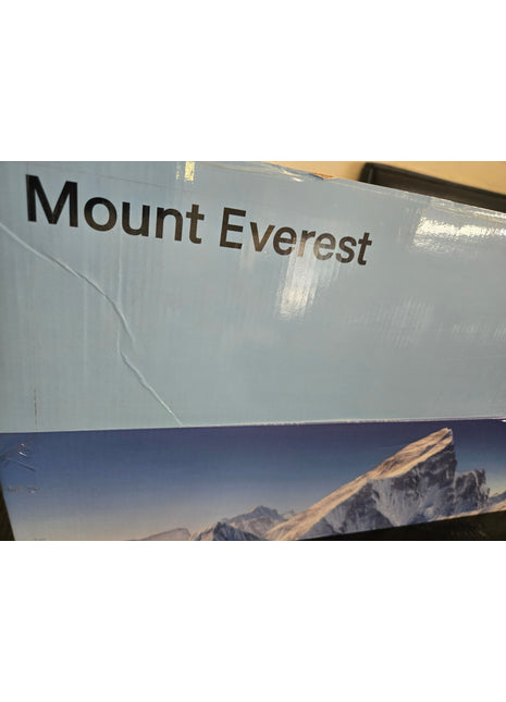 A close-up of a product box featuring the text 'Mount Everest' in dark brown lettering on a light blue background, with a printed mountain landscape image along the bottom.